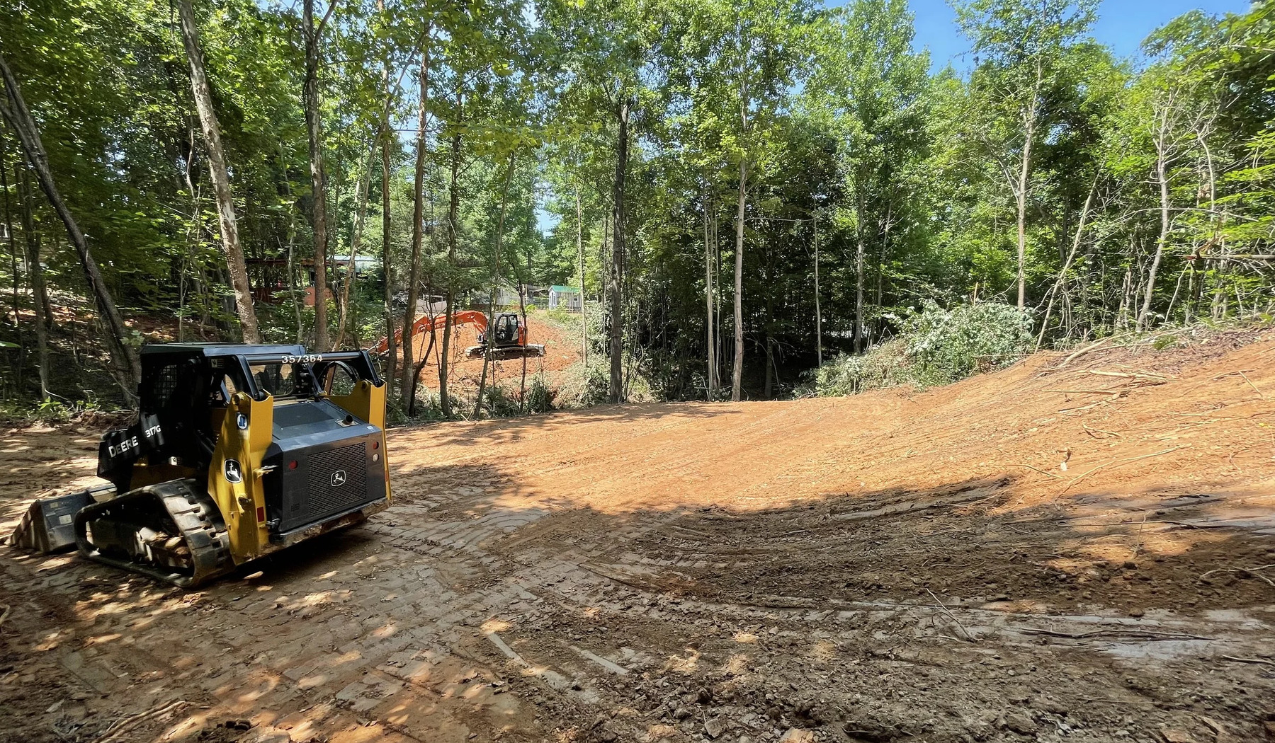 Vegetation and small tree clearing on a wooded Cherokee County Georgia lot